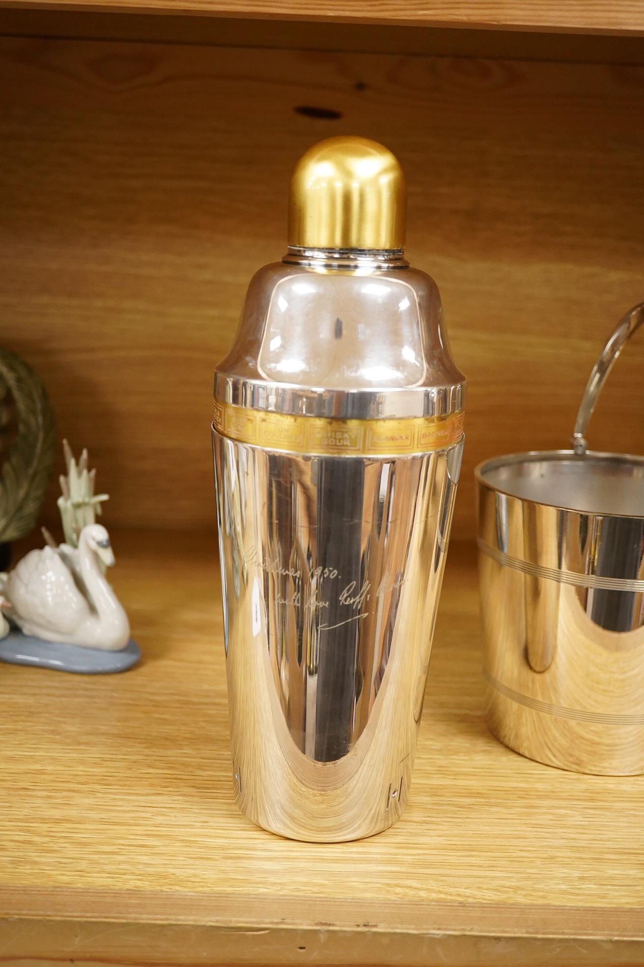 A mid 20th century silver plated patent cocktail shaker with recipes, two other cocktail shakers and an ice bucket, largest 28cm high